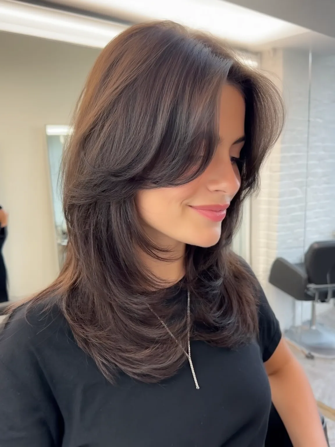 Medium Feathered Wavy Layers with Long Bangs